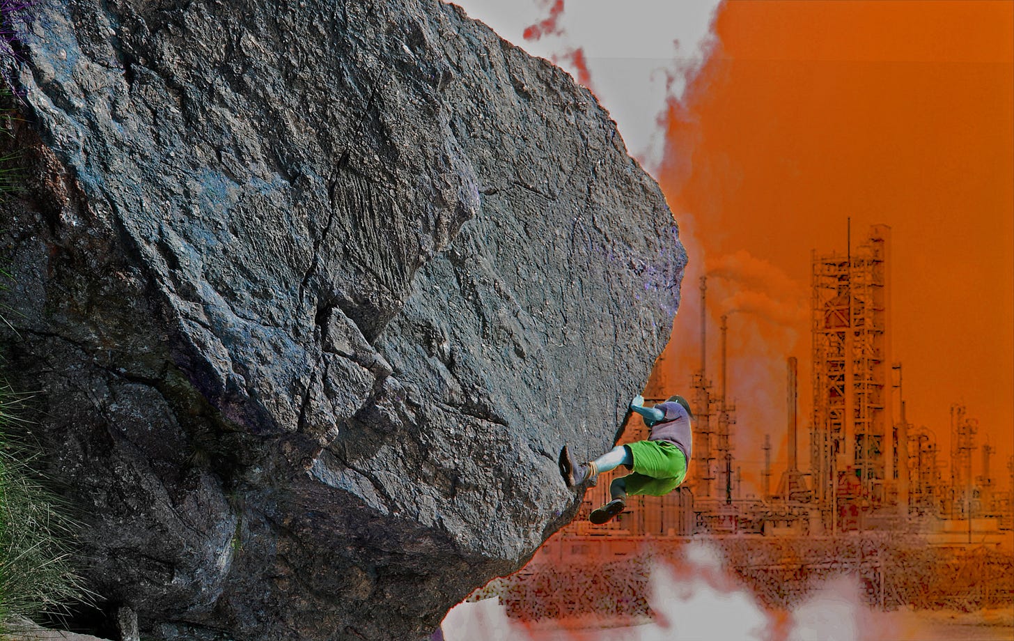 climber on overhanging rock, industrial landscape behind