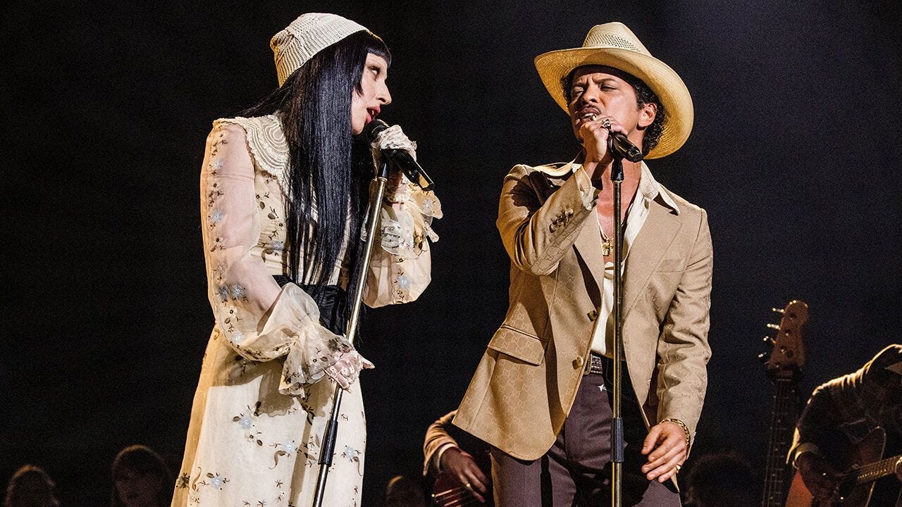 Lady Gaga and Bruno Mars perform onstage during the 67th Annual GRAMMY Awards.