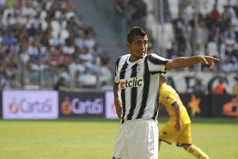 Juventus vs Parma, September 11, 2011: Arturo Vidal celebrates scoring on his debut, Juventus players embrace, fans erupt in celebration, Del Piero and teammates on the pitch, and Gianluigi Buffon giving a thumbs up during the opening match at Juventus Stadium.