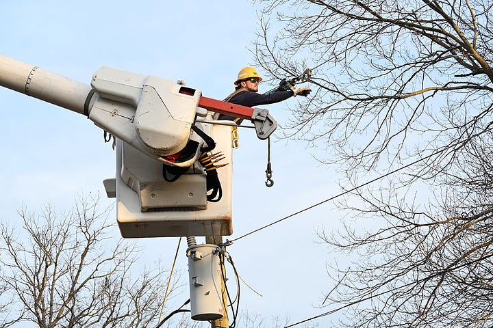(image) Graham Hughes and Mike Reynolds, two linemen with the Central Virginia Electric Cooperative (Credit CVEC)