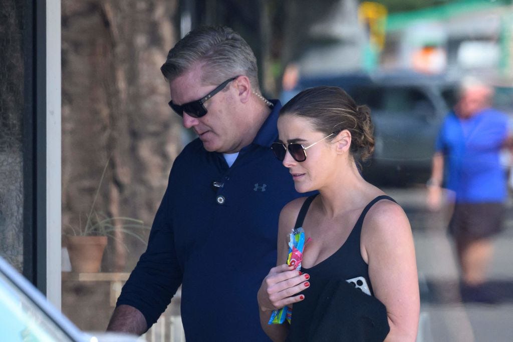 Naomi Biden, granddaughter of US President Joe Biden, is seen with a man who appears to be her Secret Service agent on August 23, 2023. (Photo by MANDEL NGAN/AFP via Getty Images)