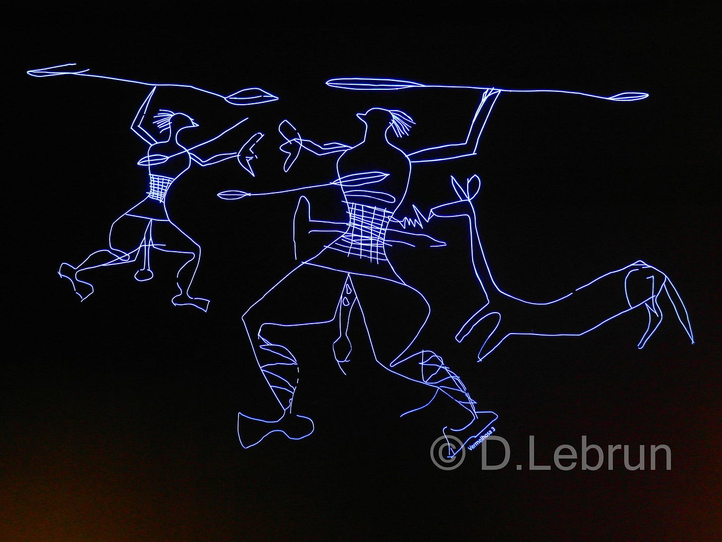 A luminous display at the prehistoric museum of Val de Coa showing some prehistoric males with an accentuated sex chasing an animal with long sticks, 2015, Portugal (photo/Dorothée Lebrun). 