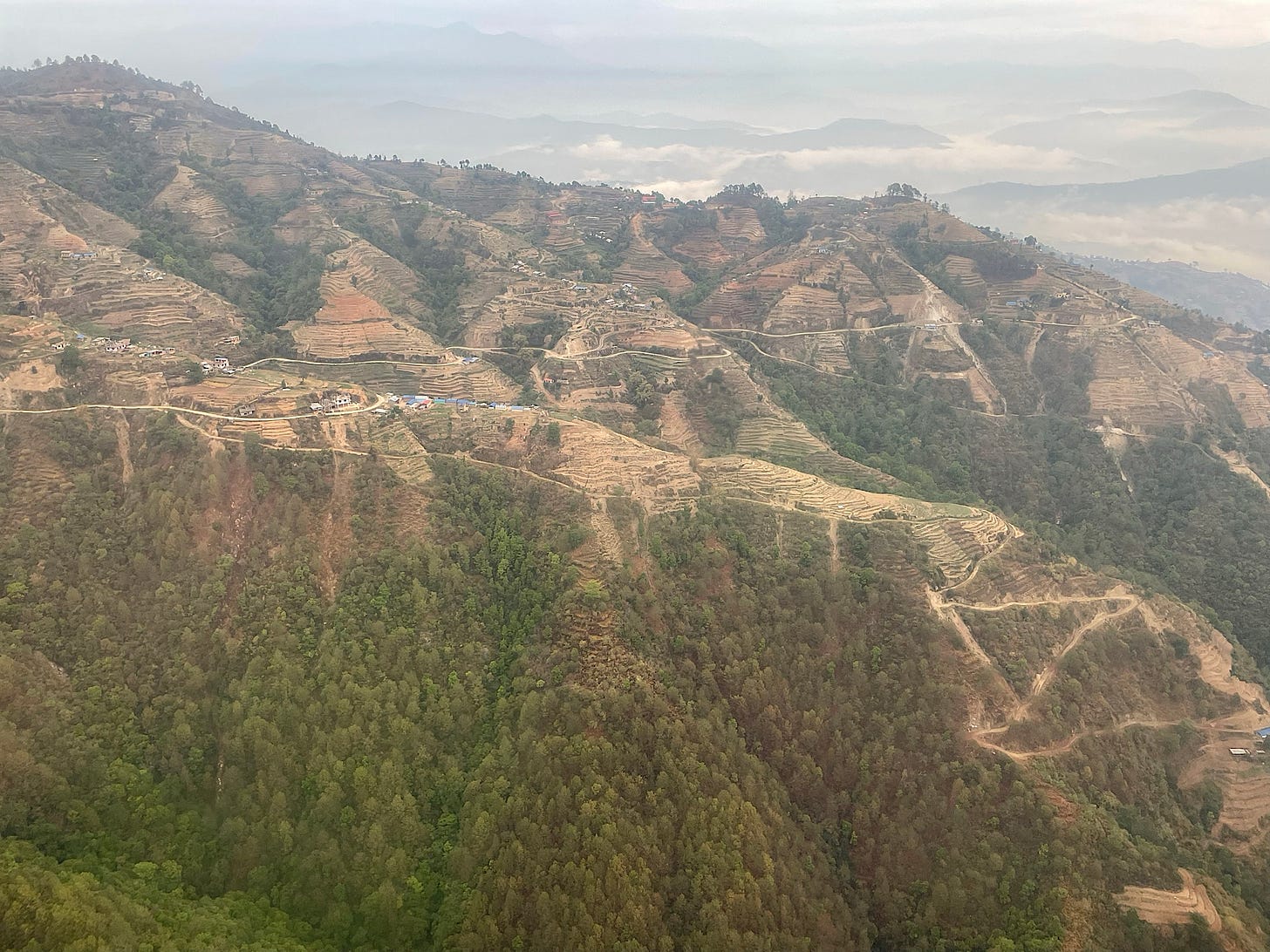 We flew close enough to see the dirt roads and paths crisscrossing the hillsides.