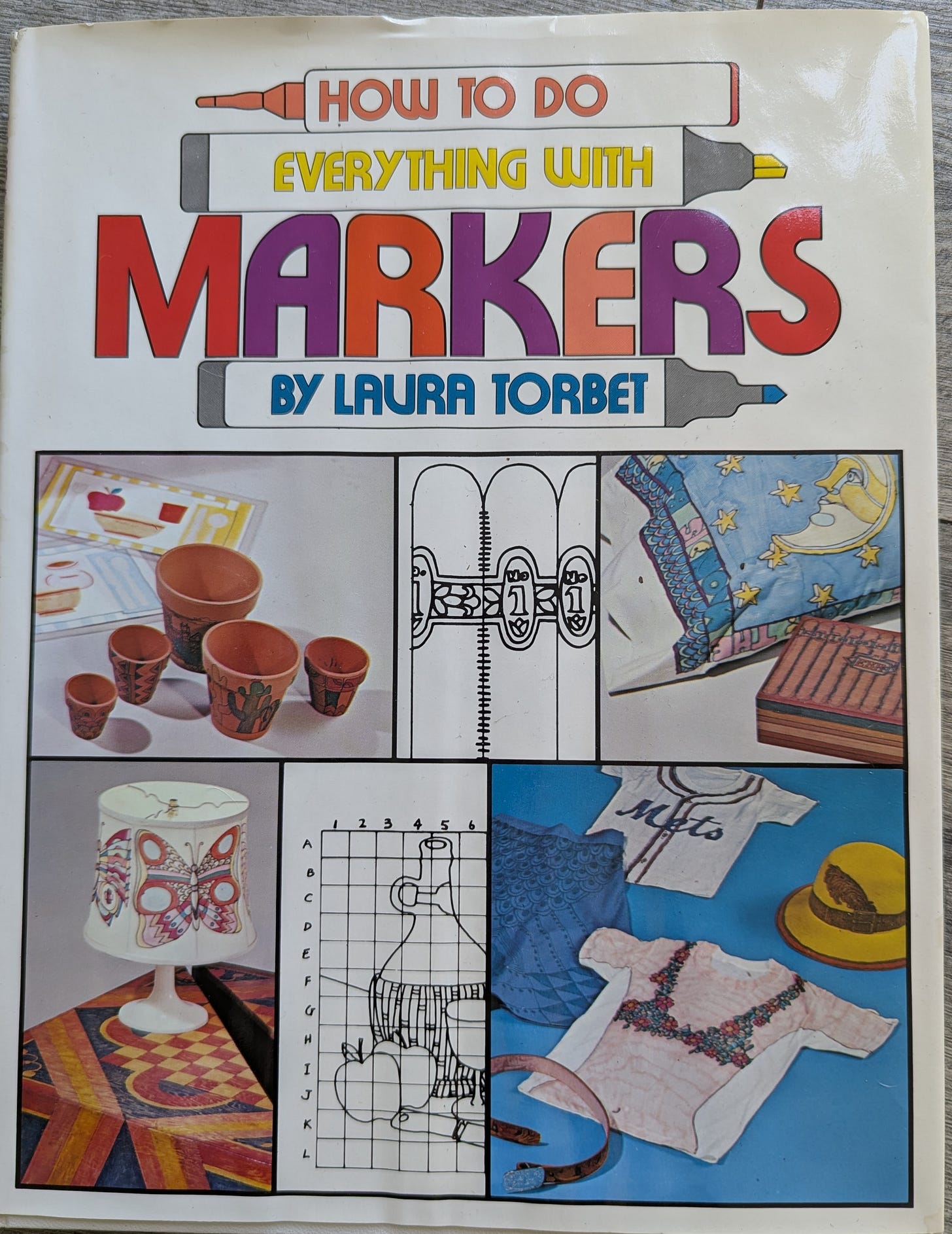 The cover of How to Do Everything with Markers by Laura Torbet. It shows a variety of her marker projects, from terra cotta pots to pillow cases to t shirts to lampshades.