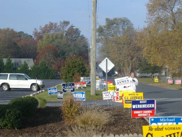 Campaigning in a sea of signs. Campaigning in a sea of signs.