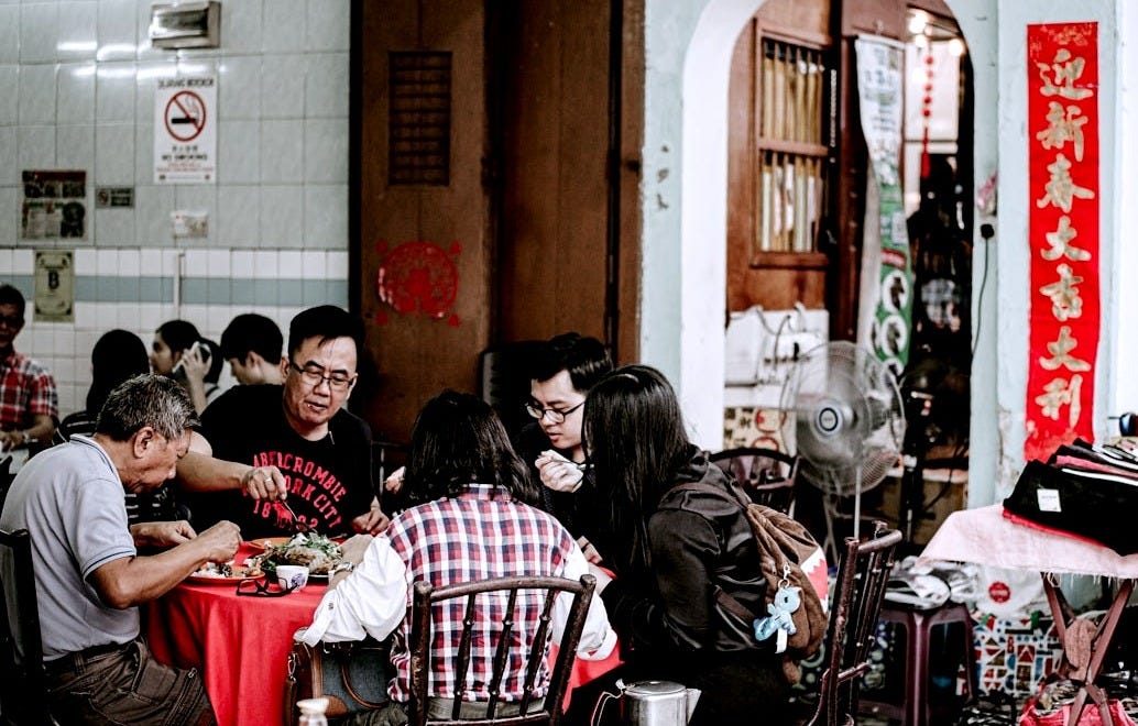 people sitting on chair in restaurant people sitting on chair in restaurant