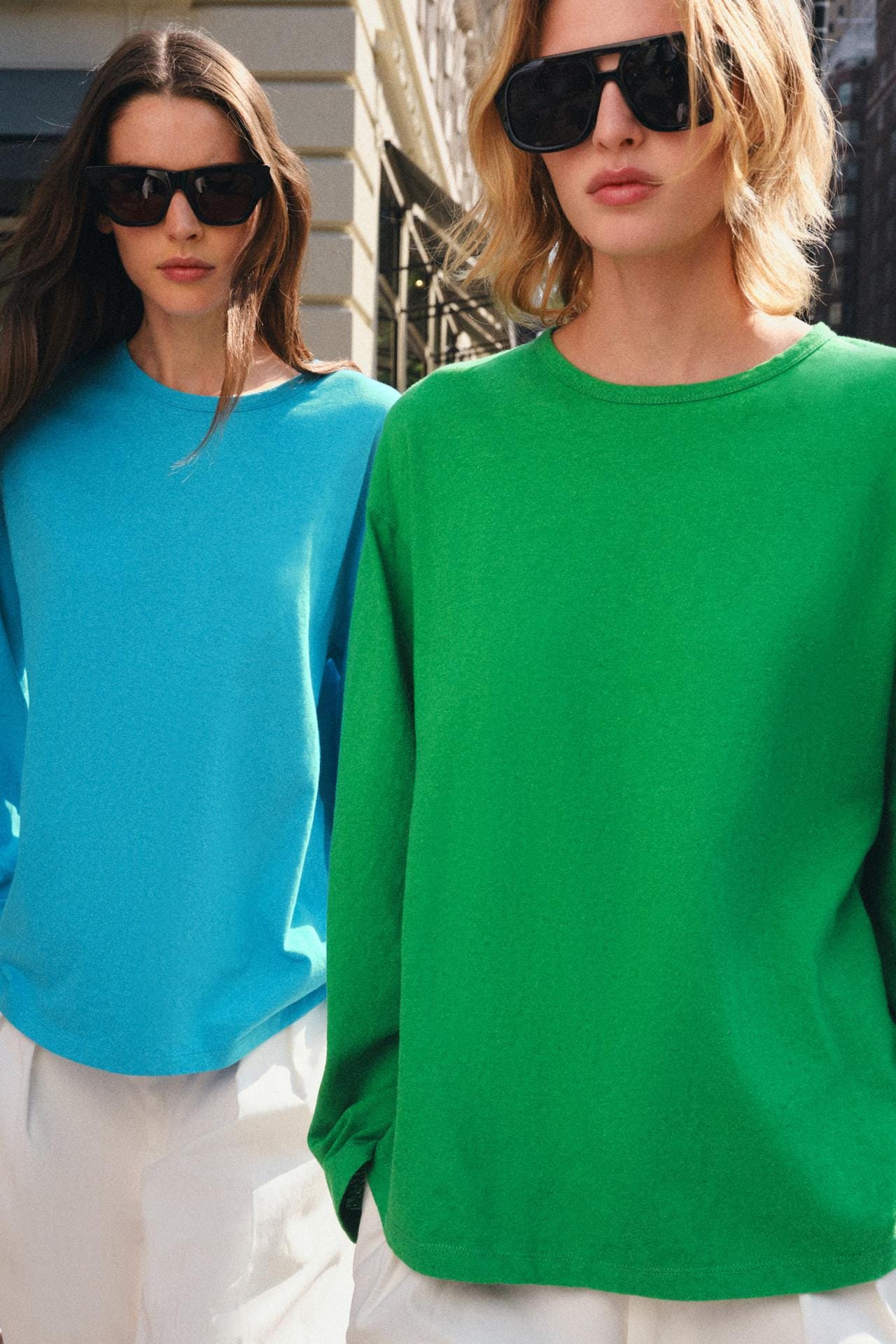 Medium shot of a long-sleeved green t-shirt, crew neck, and loose fit.