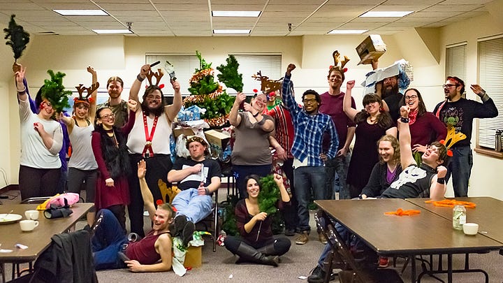 5 Pictures. 1) A group of people taking a selfie with a masked figure. 2) a group photo of people in alien costumes holding grocery bags. 3) Folks in pulpy "ancient egypt" costumes with a mummy chasing them. 4) a group of people in agressively christmasy outfits around a tree. 5) Black and white photo of a group dressed as mobsters.