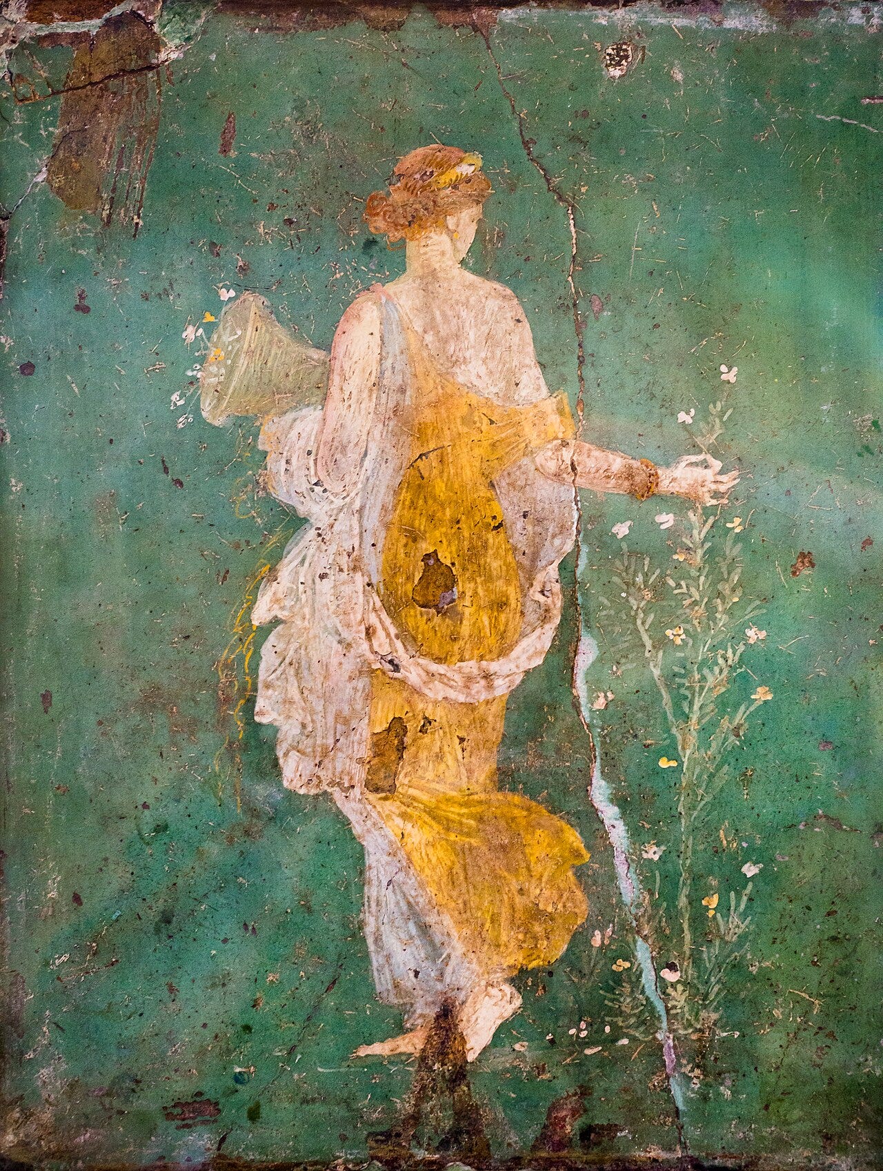 Roman wall painting of a woman in a saffron colored gown Roman wall painting of a woman in a saffron colored gown