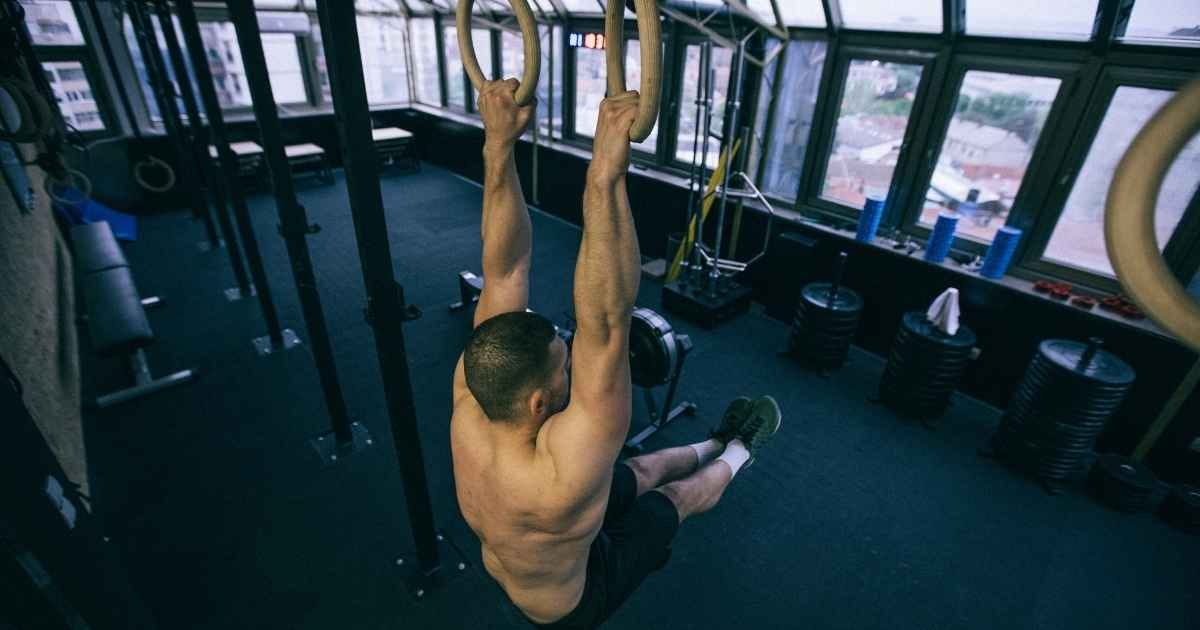 Man exercise on gymnastic rings Man exercise on gymnastic rings