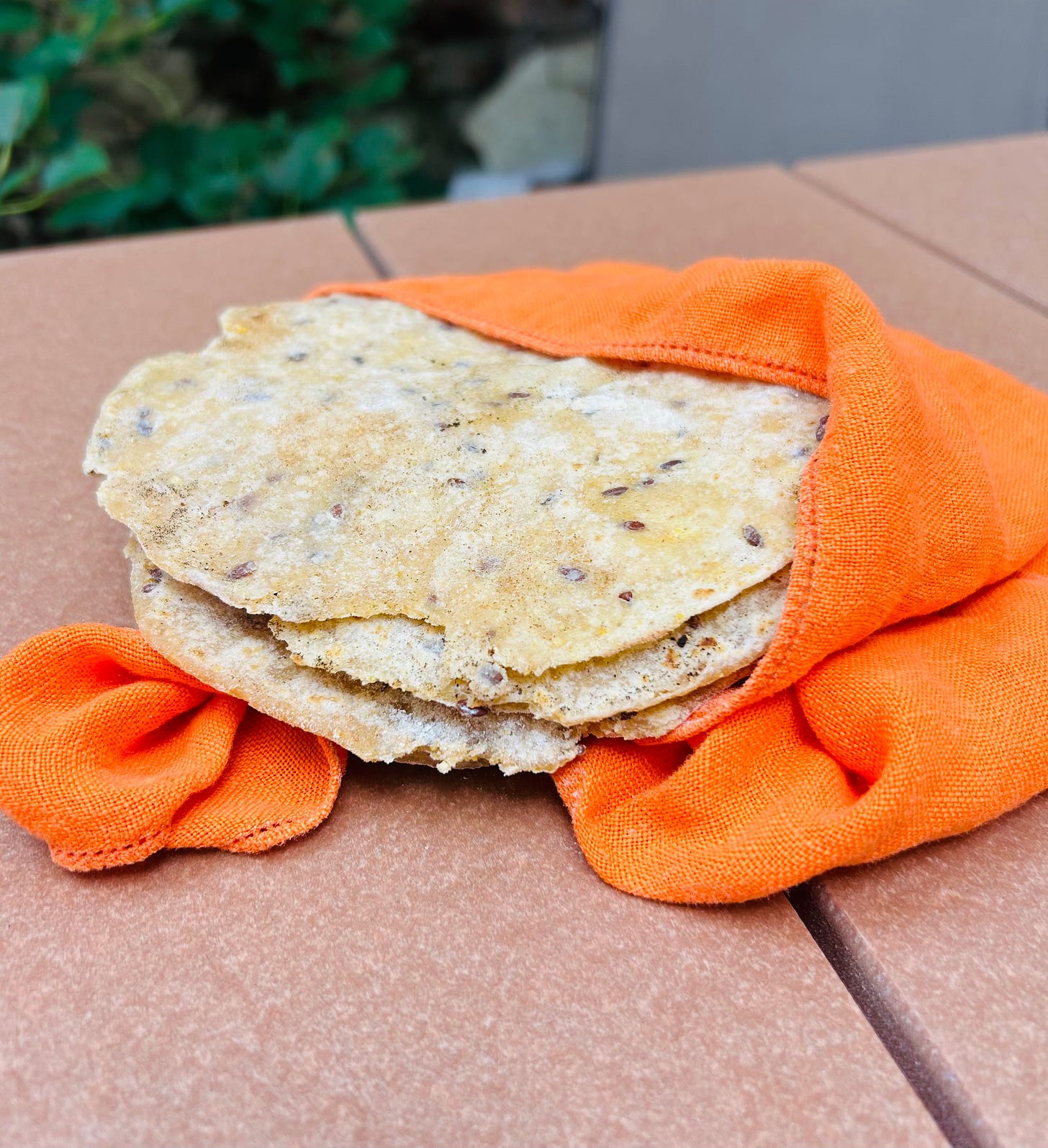 Tortillas wrapped in kitchen towel