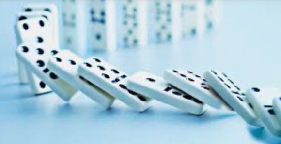 Domino dominoes falling on a blue surface

Description automatically generated