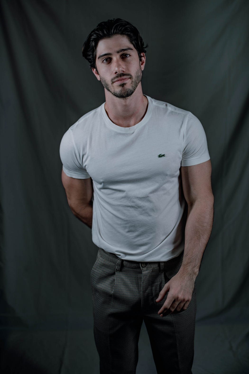 A handsome man in a T-shirt and slacks A handsome man in a T-shirt and slacks
