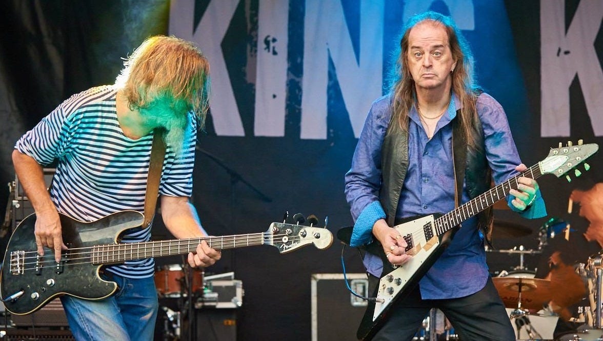 May be an image of guitar and text