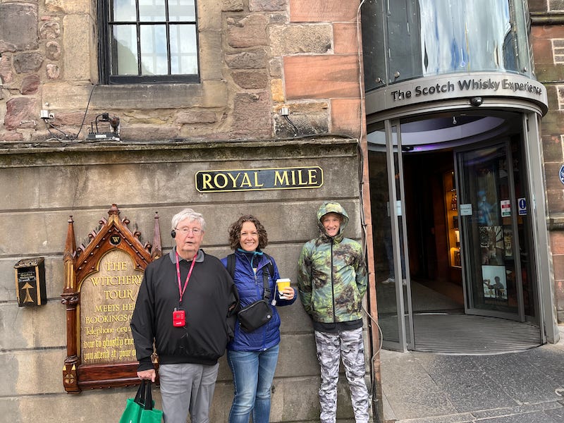 2025-6-23 John, Becky, and Hudson under the Royal Mile street sign, photo by author