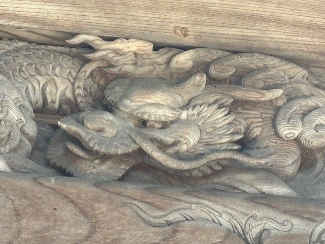 An Asian dragon carved out of wood
