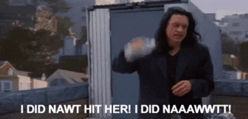 a man in a black suit is standing on a roof and says i did nawt hit her .