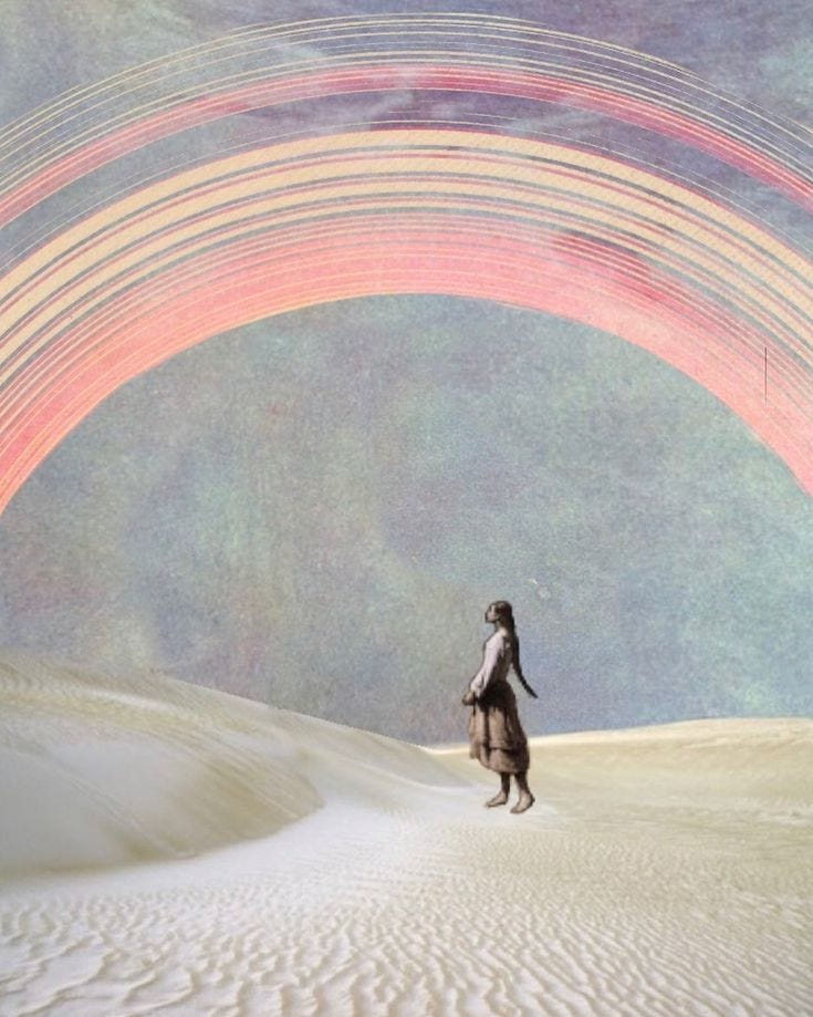 This may contain: a woman walking across a desert under a rainbow colored sky