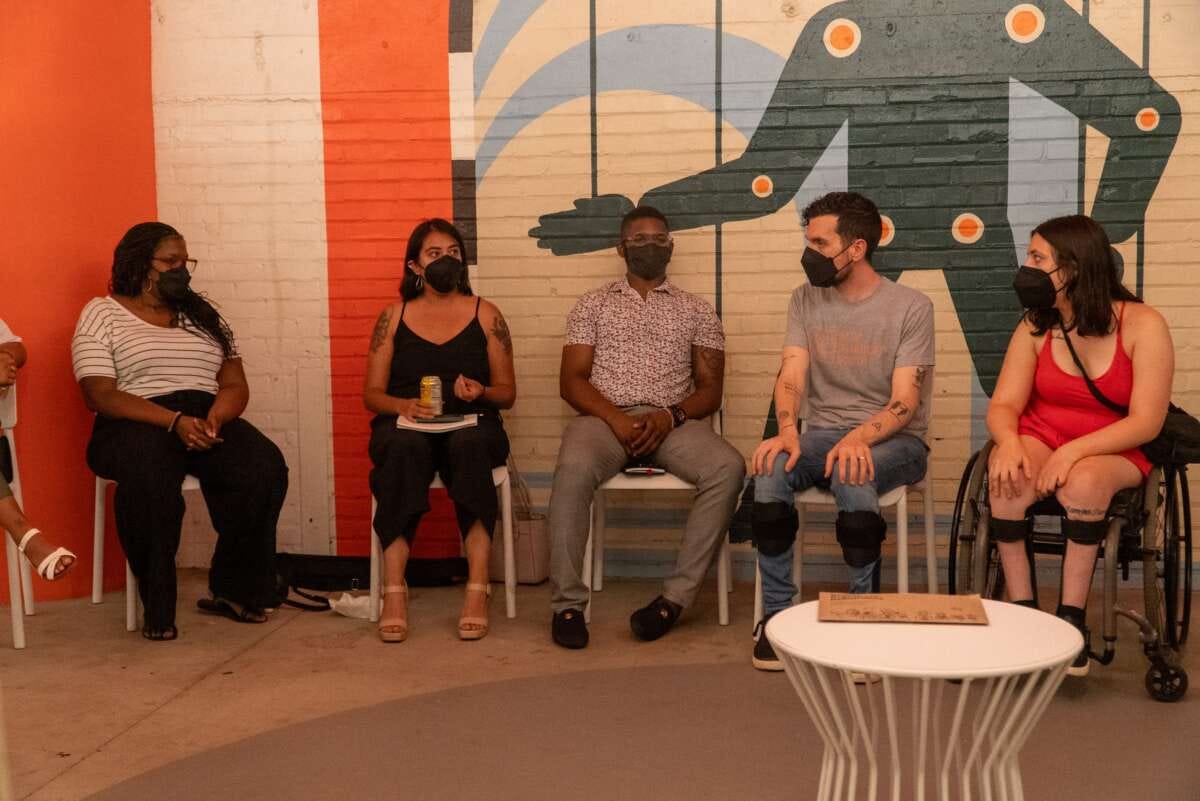 Dom Kelly (second from the right), co-founder, president, and CEO of New Disabled South, participates in a community meeting.