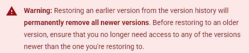 A warning message stating that restoring an earlier version will permanently remove all newer versions, advising users to confirm they don’t need the newer revisions.