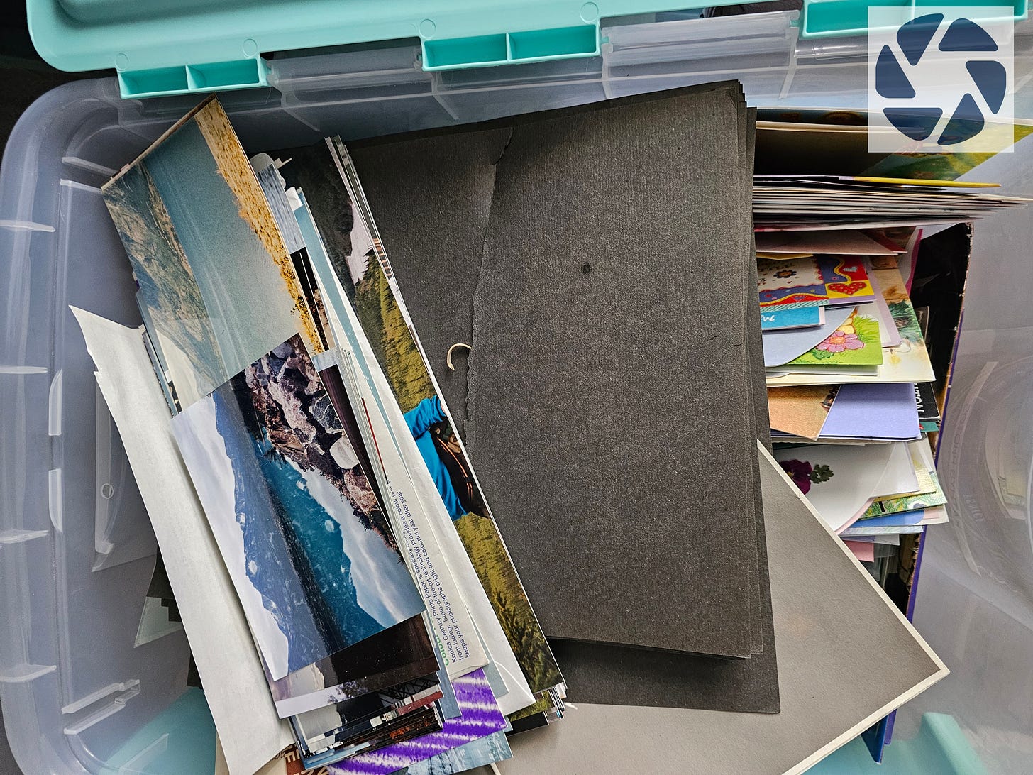 box of unorganized photos, albums and memorabilia.  Image property of Kathy Stone