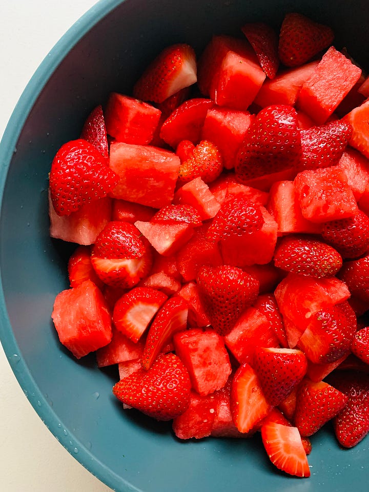 Corn and bean salad and a watermelon salad with strawberries.
