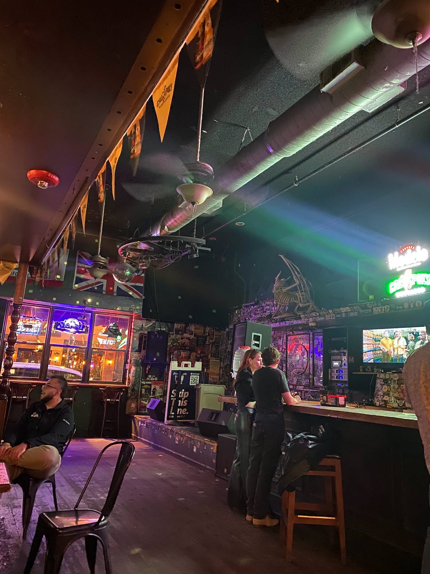 May be an image of dartboard, pinball machine and lighting