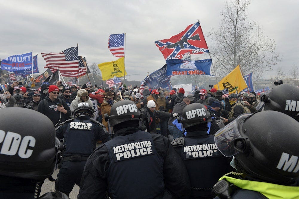 Trump supporters attack police as they storm the US Capitol on January 6, 2021 Trump supporters attack police as they storm the US Capitol on January 6, 2021