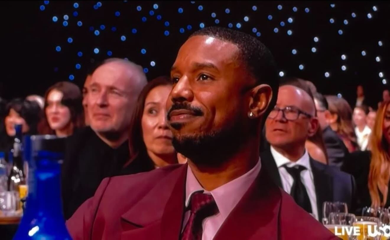 May be an image of one or more people, television, blazer, dinner jacket and text that says 'LIVE LIVEU U'