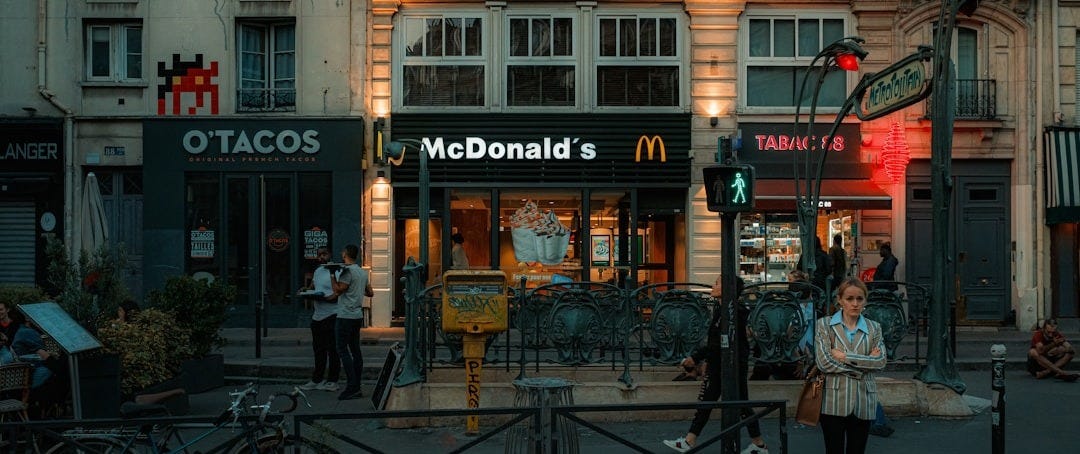 a mcdonald's restaurant is lit up at night