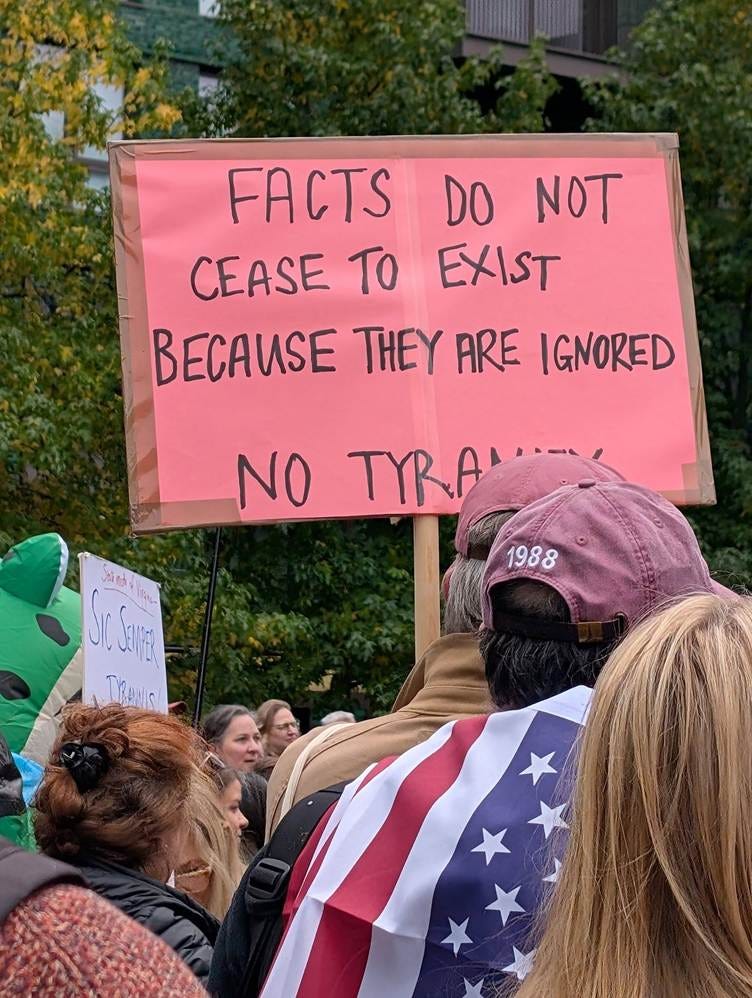 May be an image of crowd and text that says "FACTS DO NOT CEASE TO EXIST BECAUSE THEY ARE IGNORED 海色 NO TRANY 1988"