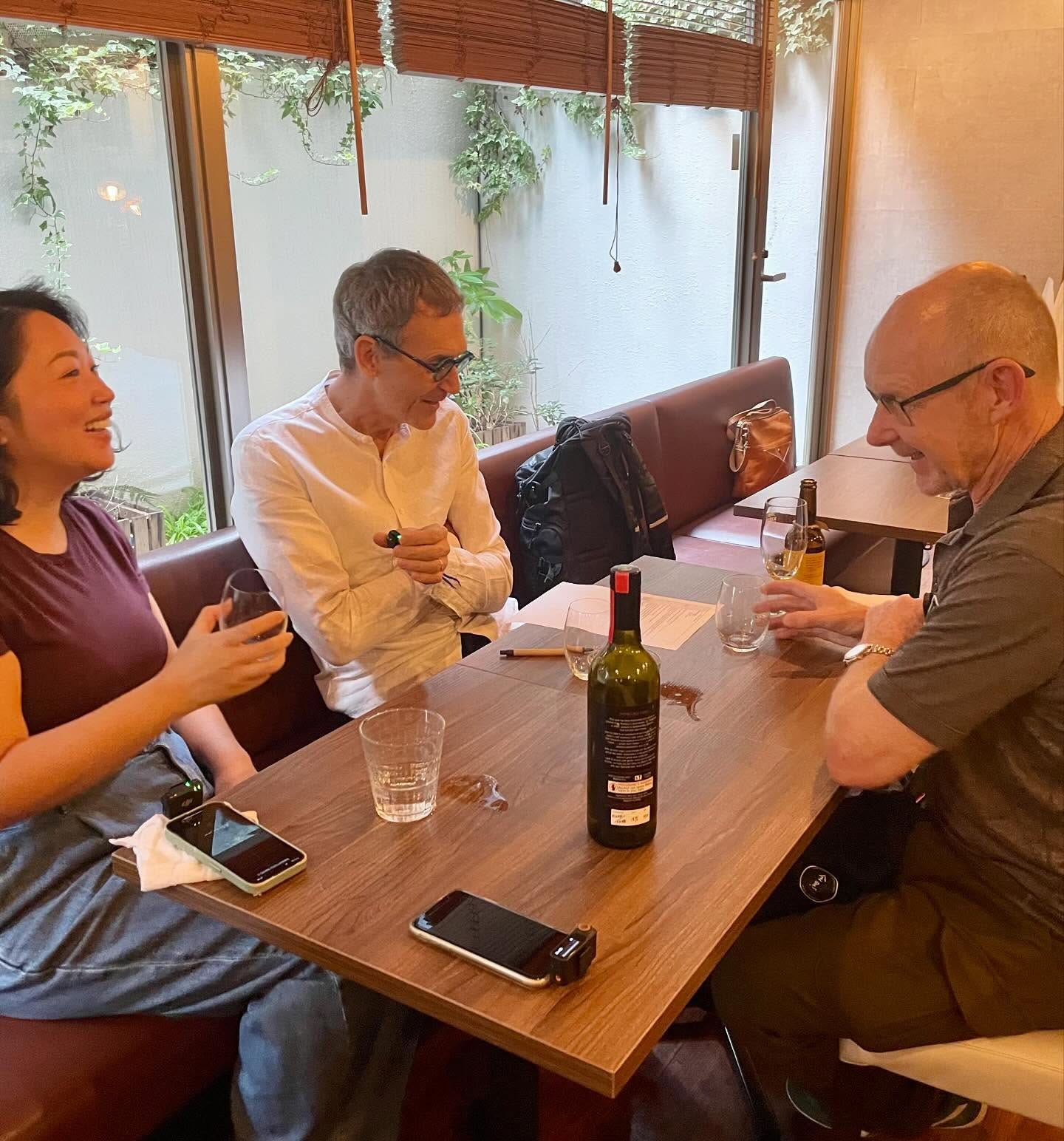 May be an image of 4 people, wine and text