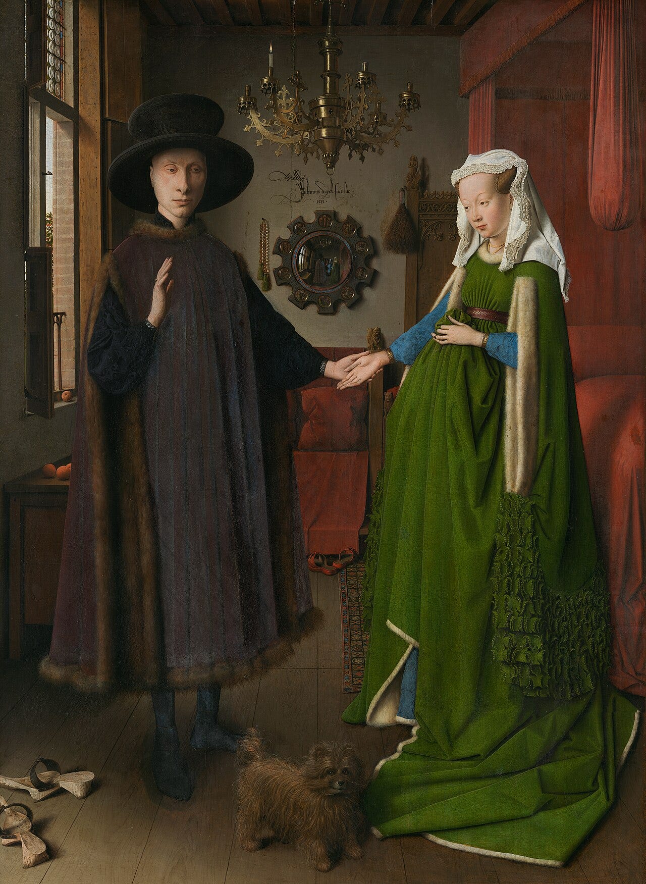 Van Eyck's Arnolfini Portrait, a couple in a chamber with a convex mirror on the wall Van Eyck's Arnolfini Portrait, a couple in a chamber with a convex mirror on the wall