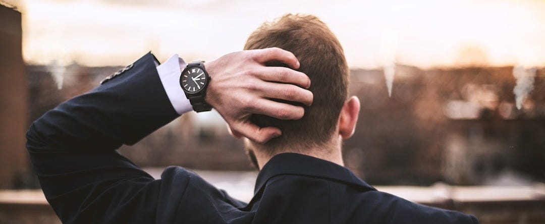 man in black long sleeve shirt wearing black watch