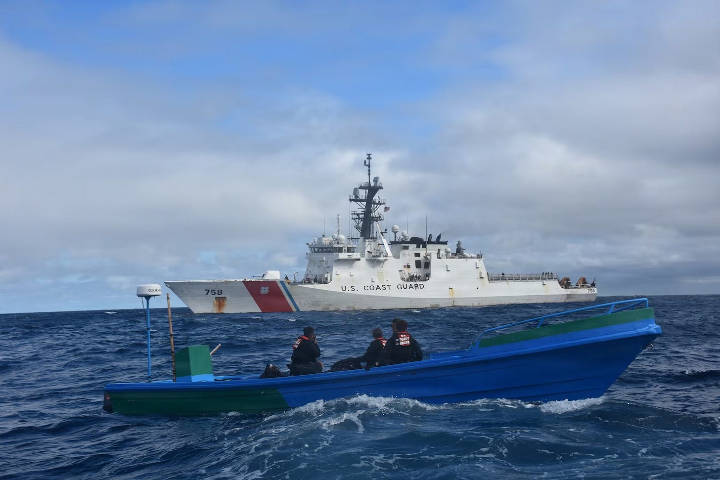 A Coast Guard boarding party from the Cutter “Stone” seizes a cartel drug smuggling boat in the Pacific Ocean