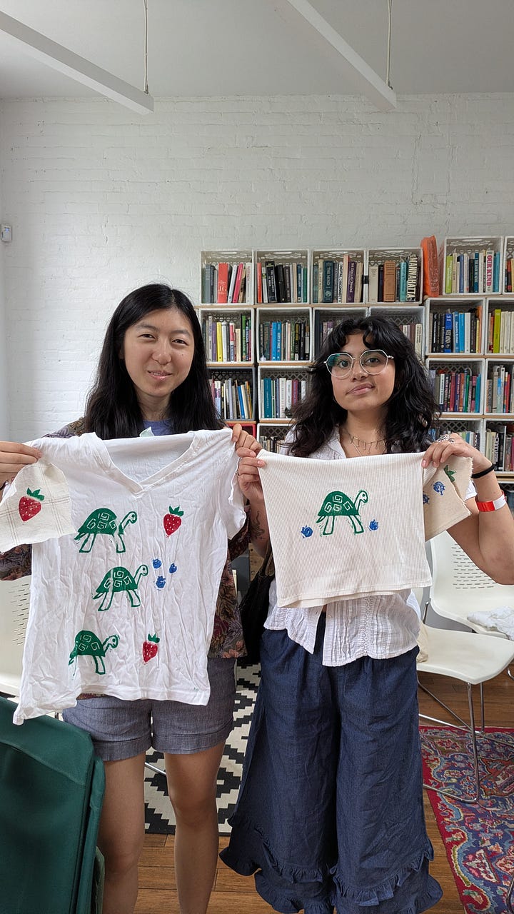 Photo 1: Linocut blogs and ink with rollers on table, Photo 2: 2 workshop participants holding shirts that they have block printed