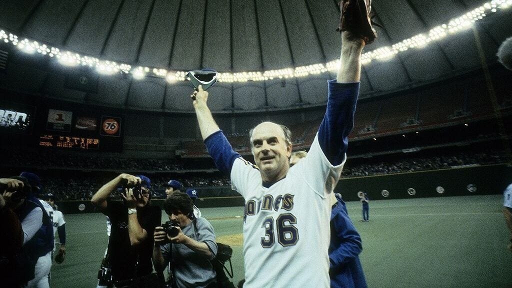 Perry celebrates his entry into baseball's 300-win club on the Kingdome field.