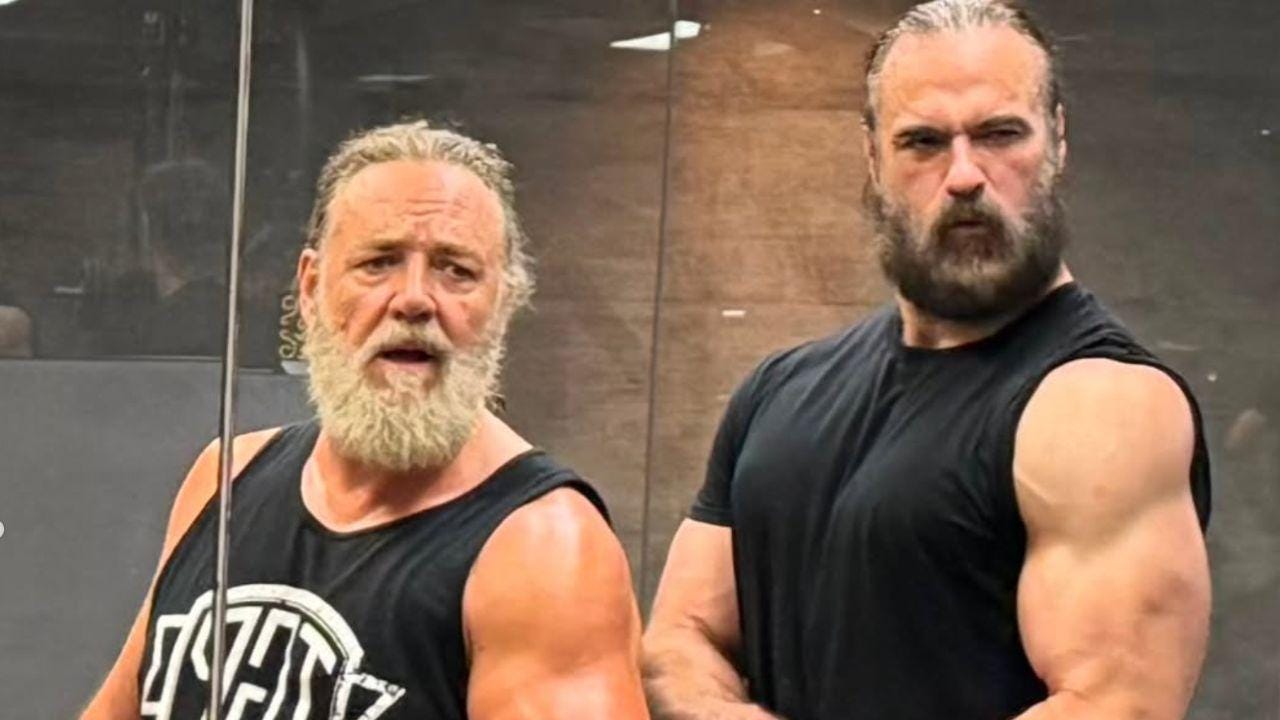 Image of Russell Crowe praised Drew McIntyre while sharing his fitness journey during 'The Last Druid' filming. Image of Russell Crowe praised Drew McIntyre while sharing his fitness journey during 'The Last Druid' filming.