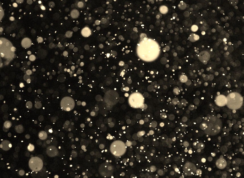a black and white photo of snow flakes a black and white photo of snow flakes