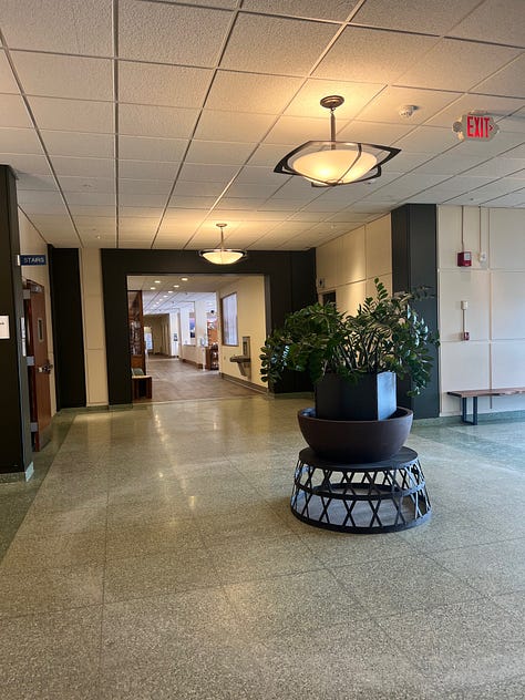 Kripalu's entrance, the lobby, a selfie of Kelsey in the elevator with the campus map, the sign to the healing arts waiting room, and a quote by W.E.B DuBois on the wall of the stairwell stating "Be ready at any moment to give up what you ae for what you might become."