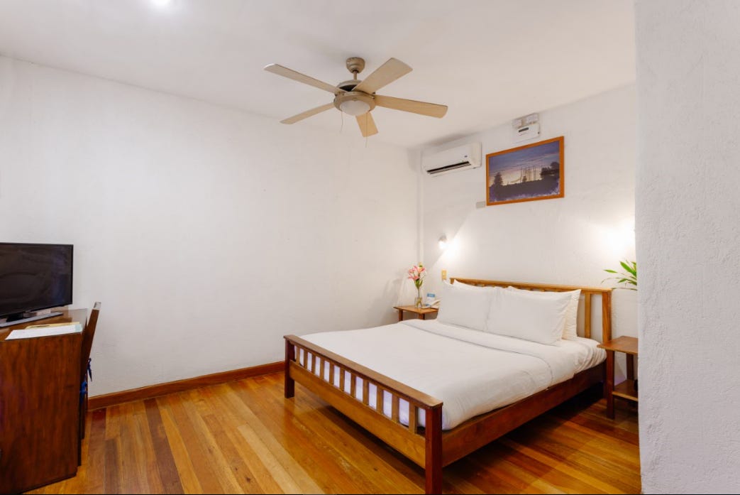 petite_suite_queen_bed_work_desk - Queen Size Bed and Work Desk