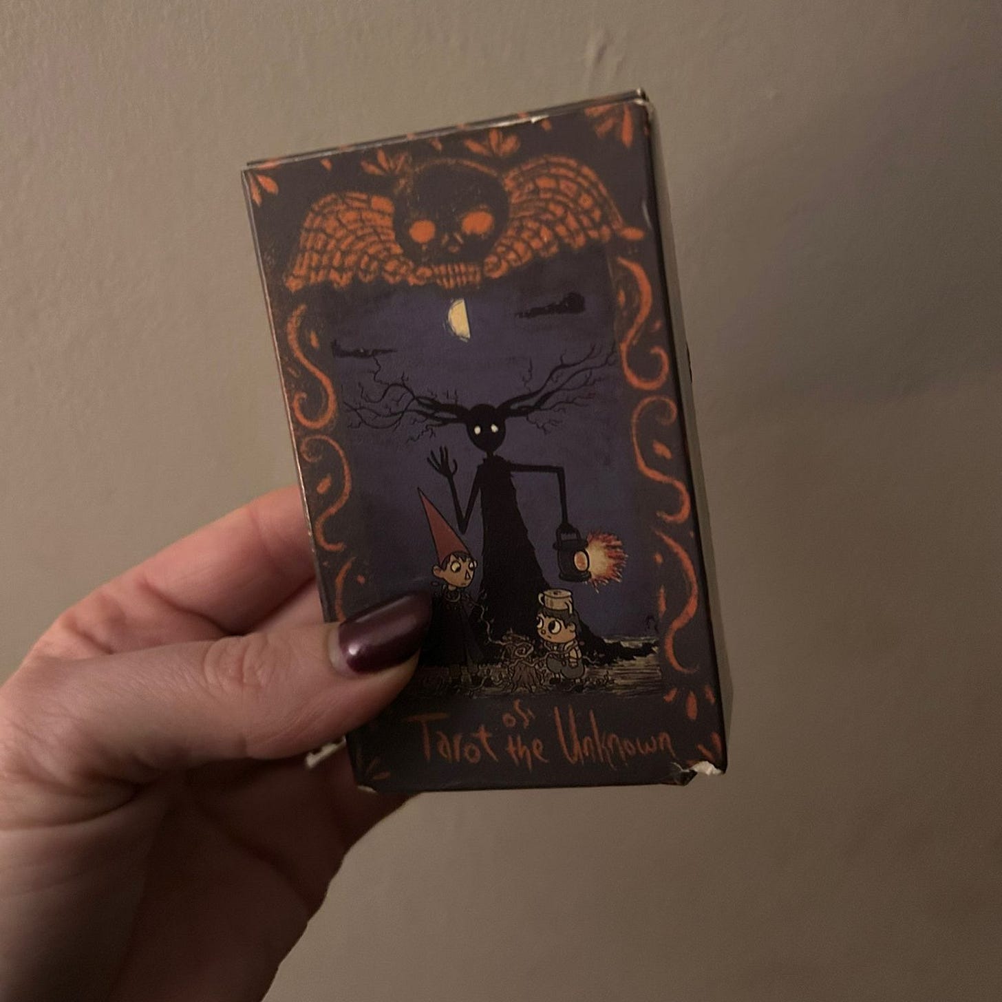Tarot of the Unknown deck box inspired by Over the Garden Wall animation - woodland folklore themed tarot deck representing journey through the unknown. Tarot of the Unknown deck box inspired by Over the Garden Wall animation - woodland folklore themed tarot deck representing journey through the unknown.