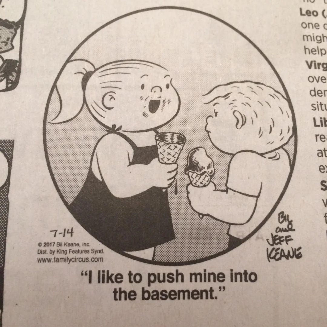 family circus girl talking to boy saying 'I like to push mine into the basement' while eating an ice cream cone