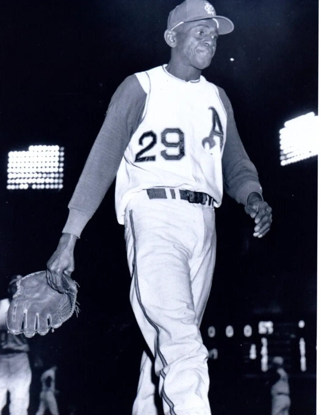 Satchel Paige walks off the field in 1965.