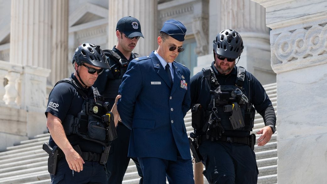 US airman arrested at Capitol after calling for Trump's impeachment is  detained again | CNN Politics