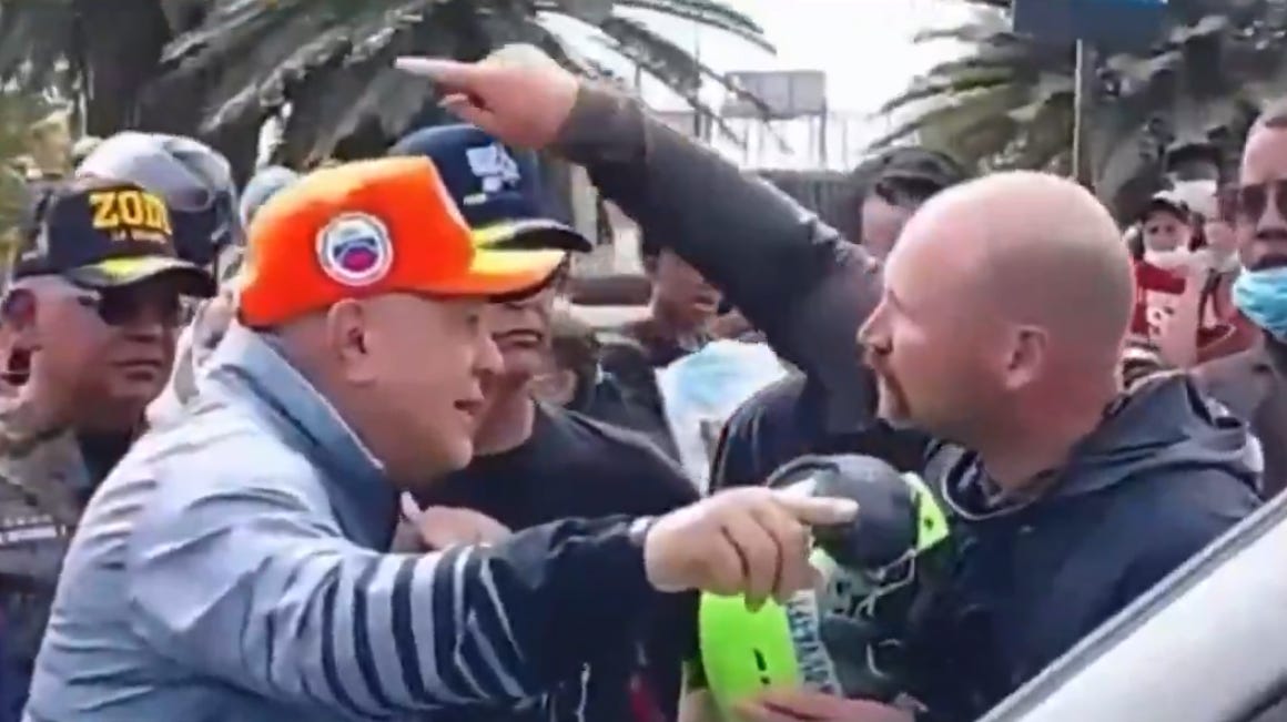 Venezuelan Interior Minister Diosdado Cabello (left) blocks a U.S. rescue team member who says, “There’s someone right over there that we’re trying to help. You don’t want us to help them?” (video from @cheo070777 via x.com)