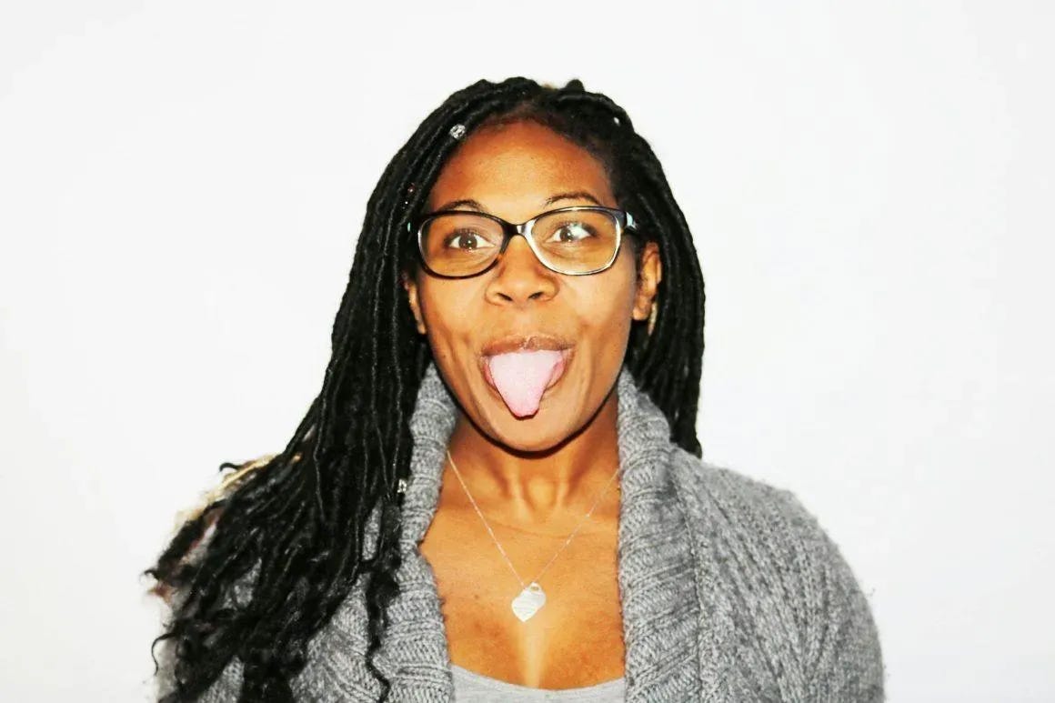 photography of woman showing her tongue
