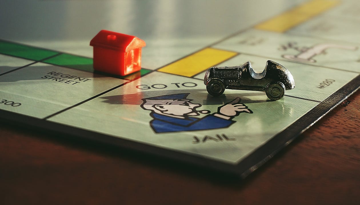 Free Miniature Toy Car on Monopoly Board Game Stock Photo Free Miniature Toy Car on Monopoly Board Game Stock Photo