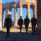 Four Middle-Aged Guys With Weird Badges