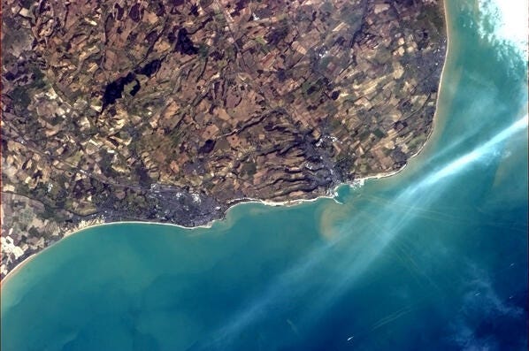 Folkestone and Dover from the International Space Station, showing the White Cliffs and the tracks of ferries. Folkestone and Dover from the International Space Station, showing the White Cliffs and the tracks of ferries.